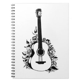 Cuaderno Guitarra acústica sobre un fondo de flores.
