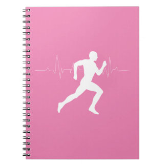 Cuaderno Hombre corriendo una silueta sobre fondo rosado