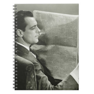 Cuaderno Hombre de negocios que lee el periódico