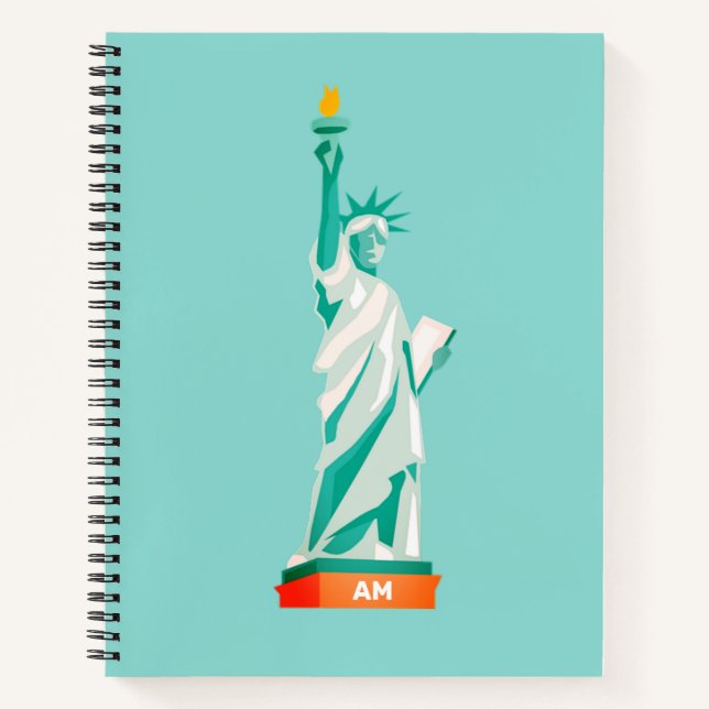 Cuaderno Lady Liberty y el monograma sobre la luz Verde azu (Anverso)