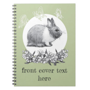 Cuaderno Liebre esponjosa con mariposas sobre fondo verde