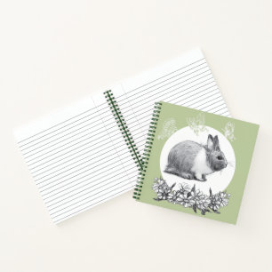 Cuaderno Liebre esponjosa con mariposas sobre fondo verde
