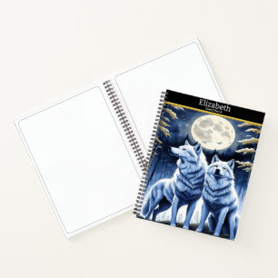 Cuaderno Lobos majestuosos aullando bajo un luminoso claro