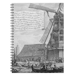 Cuaderno Luchando un fuego en un molino de viento cerca de