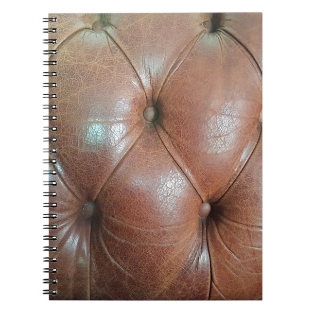 Cuaderno Luz sobre la superficie del sofá de cuero marrón,  (Frente)