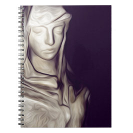 Cuaderno mano en el corazón