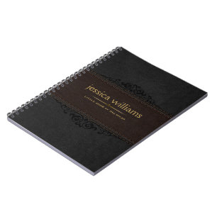 Cuaderno marrón y negro con elemento floral negro