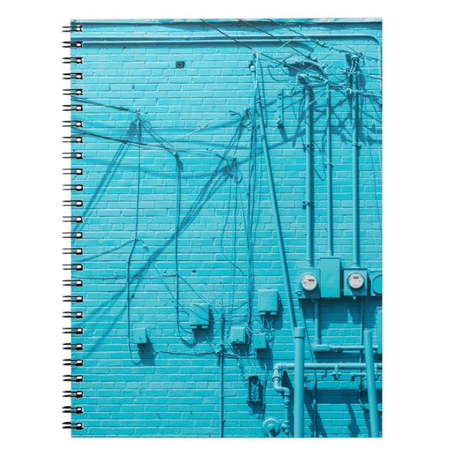 CUADERNO METRO ELÉCTRICO SOBRE LA PARED DE LADRILLO AZUL (Frente)