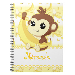 Cuaderno Mono lindo de Kawaii que sostiene el plátano