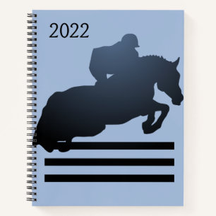 Cuaderno Mostrar salto limpiando un obstáculo
