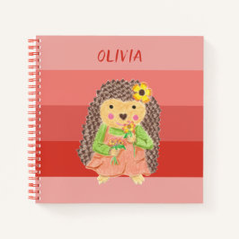 Cuaderno naranja erizo niño oliendo flores