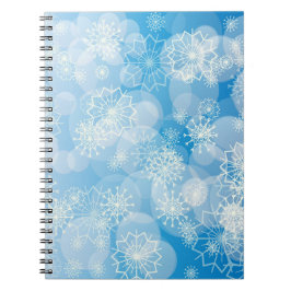Cuaderno Navidades con copos de nieve en un fondo azul