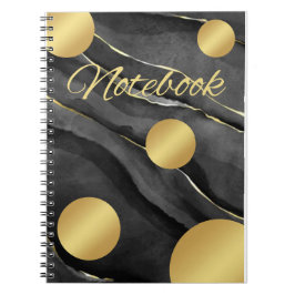 Cuaderno negro con puntos dorados