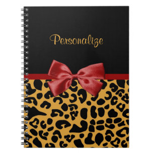 Cuaderno Negro de moda y arco rojo de la cinta del