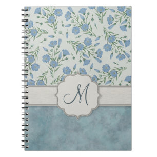 Cuaderno Nomeolvides azul floral y de mármol con el monogra