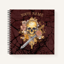 notebook de cráneo dorado