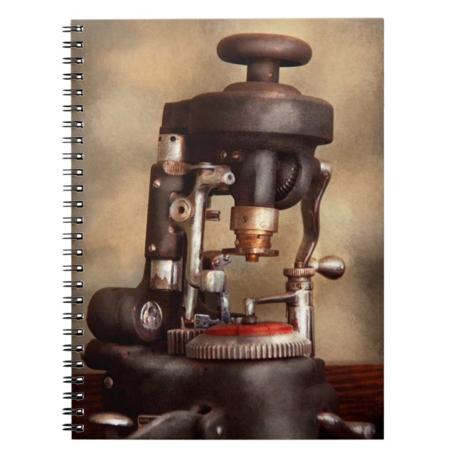 Cuaderno Optometría - Máquina de corte de lentes (Frente)