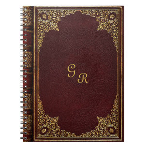 Cuaderno Ornamental dorado sobre el marrón con las iniciale