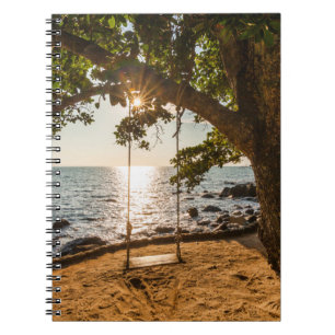 Cuaderno Oscilación en la playa en la puesta del sol