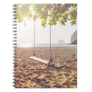 Cuaderno Oscilación en la playa en la puesta del sol