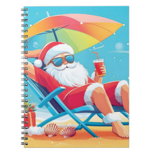 Cuaderno Papá Noel relajándose en una tumbona de playa trop