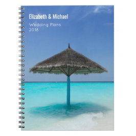 Cuaderno Paraguas con paja en los planes tropicales de boda