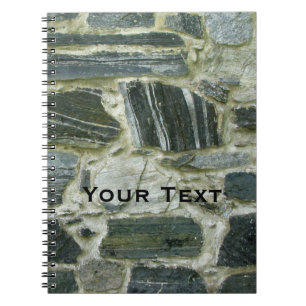 Cuaderno Pared de piedra vieja con el texto