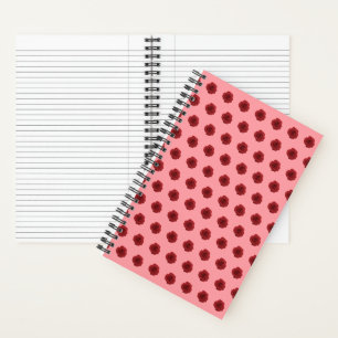 Cuaderno Patrón sin foco de las flores rojas en un portátil