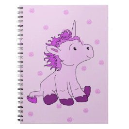 Cuaderno Pequeña Unicornio en un fondo rosa