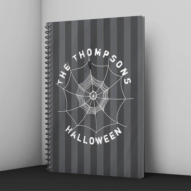 Cuaderno personalizado de Halloween de telaraña de (Personalized Halloween notebook with spider web and spider on dark striped background.)