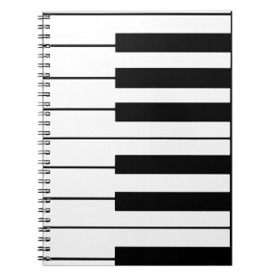 Cuaderno piano con temas musicales