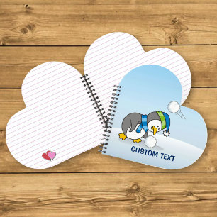 Cuaderno Pinguino pequeño recibiendo una bola de nieve
