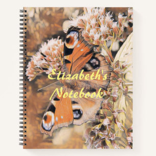 Cuaderno Pintura de una mariposa naranja sobre las flores