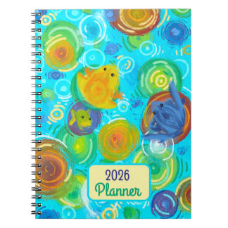 Cuaderno Planificador 2026 con ranas coloridas en agua colo