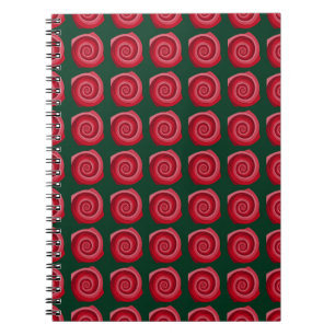 Cuaderno rosas rojas en un fondo verde abstracto, de fondo