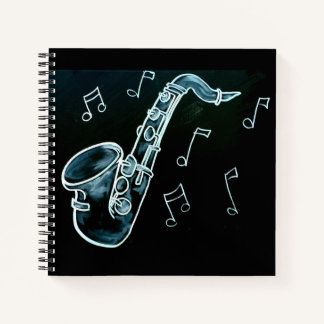 Cuaderno Saxofón y notas musicales