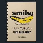 Cuaderno Sonrisa es buena para la salud 70th Birthday Guest<br><div class="desc">Arte gráfico: Banana orientada a formar una sonrisa texto pequeño entre corchetes: (es bueno para la salud). Perfecto para cualquiera que siga sonriendo año tras año. Diseño en cuaderno en espiral como libro de invitados con textos para la fiesta de cumpleaños número 70 al personalizar. Puede cambiar fácilmente el texto...</div>