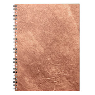Cuaderno Superficie de cobre cepillada, textura metálica.
