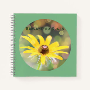 Cuaderno Susan de ojos negros flor sobre el verde del mar o