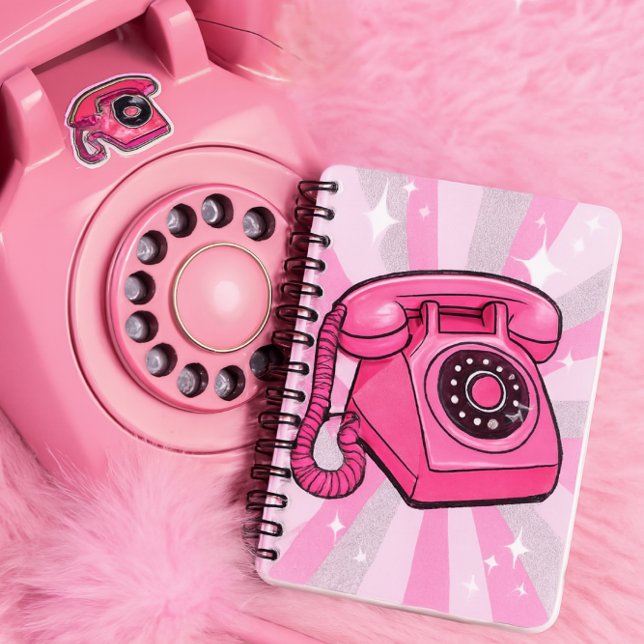Cuaderno Teléfono Fijo Giratorio Retro Rosa Brillo (Notebook features a bold pink rotary phone with sparkle pop art rays in pink, white, and silver)