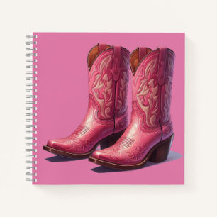 Cuaderno Un portátil con botas rosas.