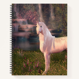 Cuaderno Unicornio frente a un bloc de notas en espiral de