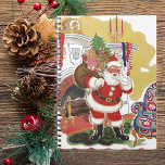 Cuaderno Vintage Christmas, Jolly Santa Claus con presentes<br><div class="desc">Diseño de vacaciones de Navidades de ilustracion de época del clásico libro de cuentos para niños "Fue la noche antes que los Navidades". Este diseño presenta un alegre Santa Claus en una sala de estar de la casa de un niño después de haber bajado la chimenea con un saco lleno...</div>
