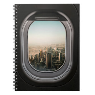 CUADERNO VISTA DE LA CIUDAD A TRAVÉS DEL AVIÓN DURANTE EL D