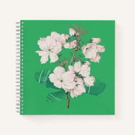 Cubierta verde con cuaderno de flores blancas
