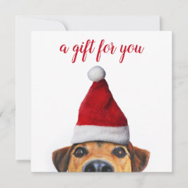 Curioso perro gracioso con tarjeta de regalo de Sa