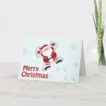 Cute Santa Claus haciendo tarjeta de navidad de án<br><div class="desc">Esta tarjeta de felicitación plegada de la Fiesta del Navidad tiene una imagen de Santa Cláusula haciendo un ángel de nieve con Feliz Navidad escrito en la parte inferior izquierda. Al fondo,  hay muchos copos de nieve azules.</div>