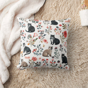 Cuto de gatos y almohada de motivos florales Acoge