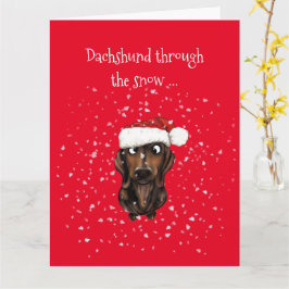 Dachshund a través de la nieve... Tarjeta de navid