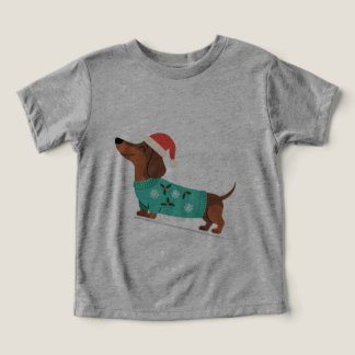 Dachshund con suéter de Navidad y sombrero de Sant
